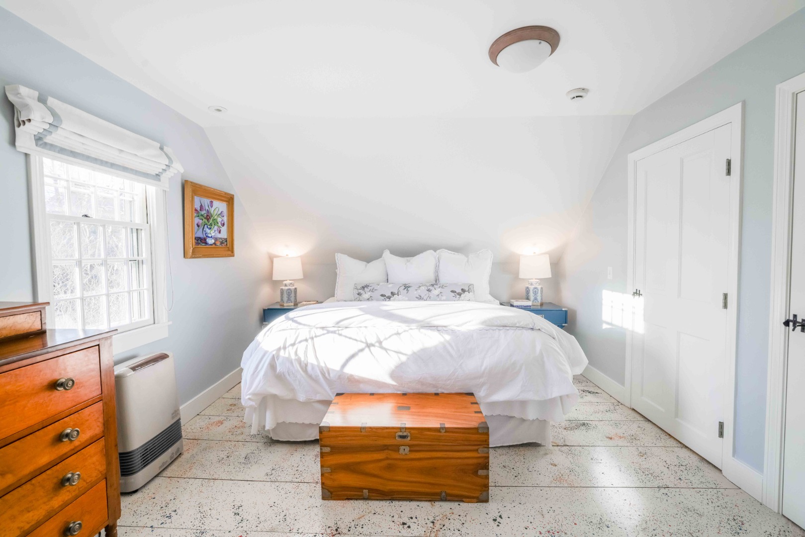 13 West Chester Street Nantucket, MA 02554 - Photo 26 of 32 a bedroom with a bed and wooden floor