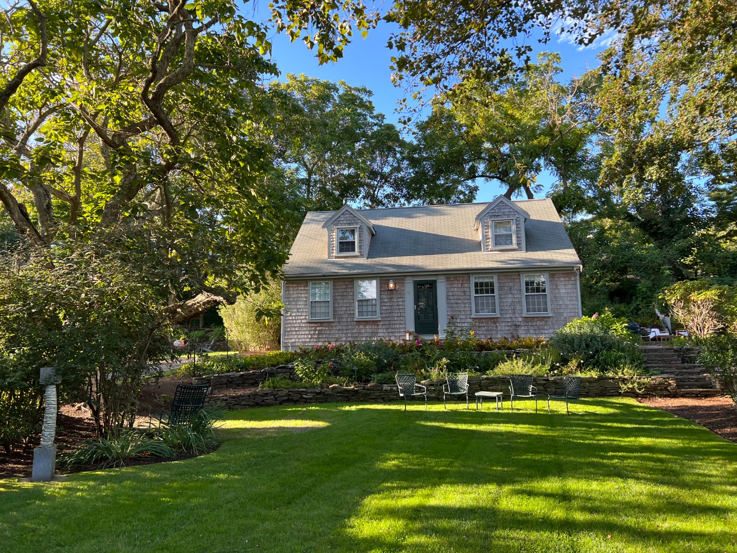 13 West Chester Street Nantucket, MA 02554 - Photo 32 of 32 a front view of a house with a garden