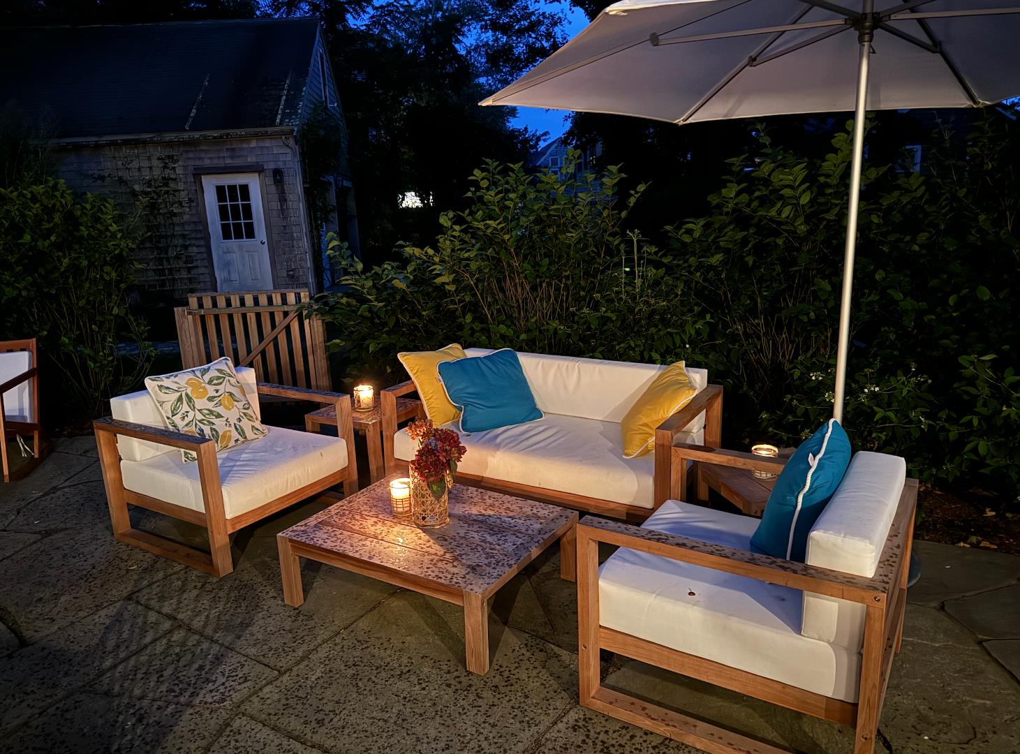 13 West Chester Street Nantucket, MA 02554 - Photo 4 of 32 a blue bench sitting in front of a house