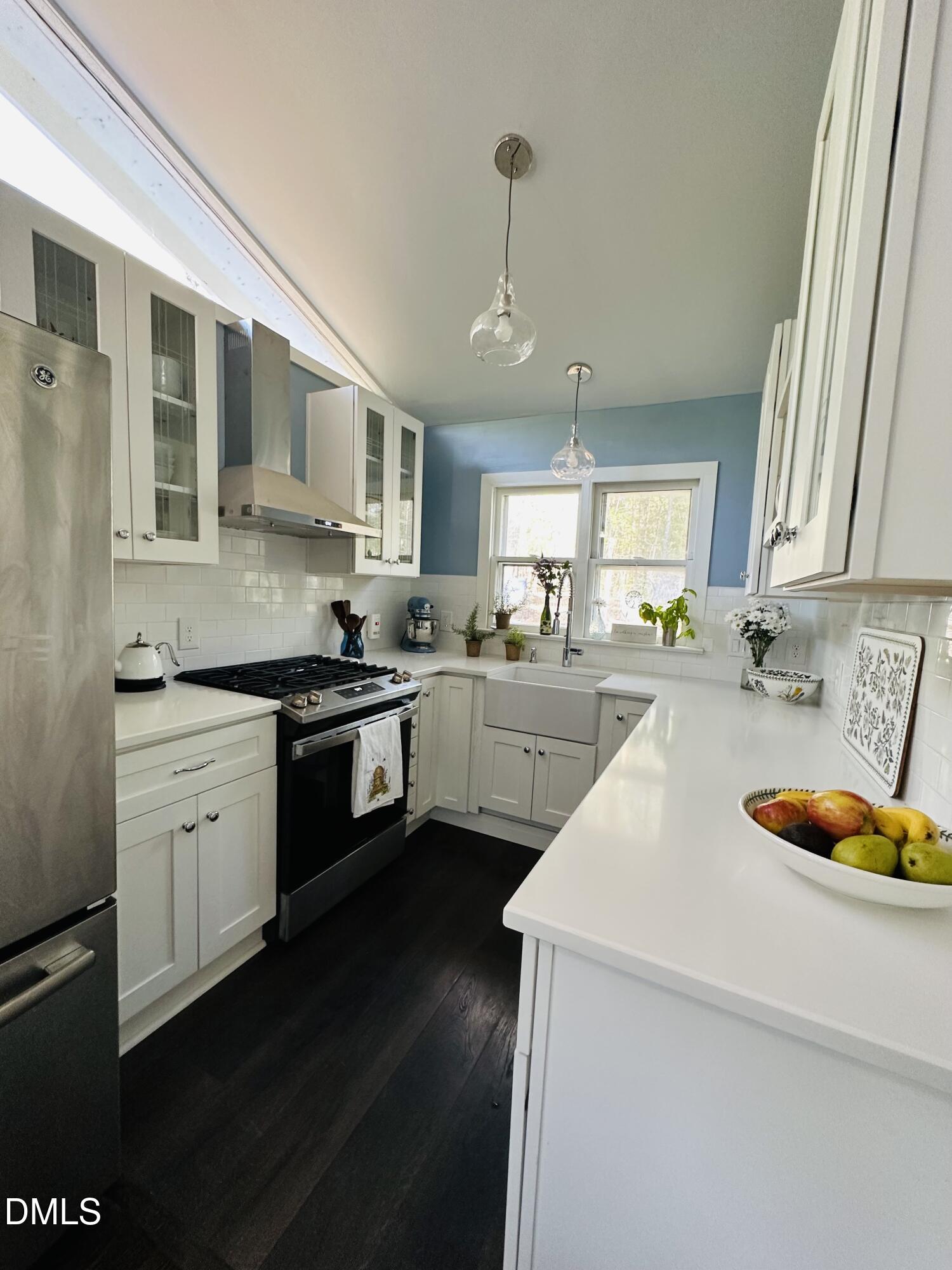 6202 Montgomery Ests Road Hillsborough, NC 27278 - Photo 18 of 91 a kitchen with a sink a stove and cabinets