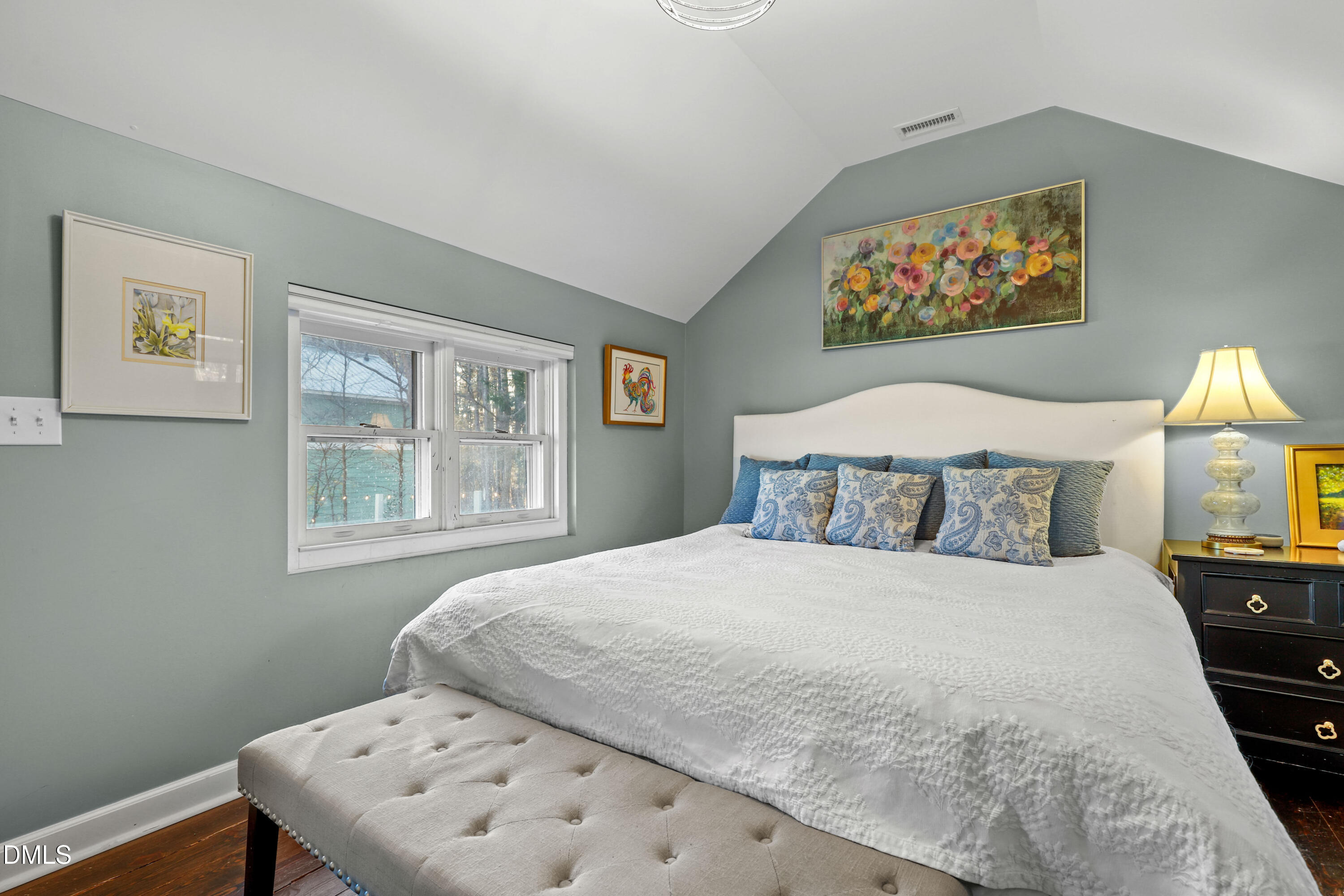 6202 Montgomery Ests Road Hillsborough, NC 27278 - Photo 19 of 91 a bedroom with a bed and a painting on the wall