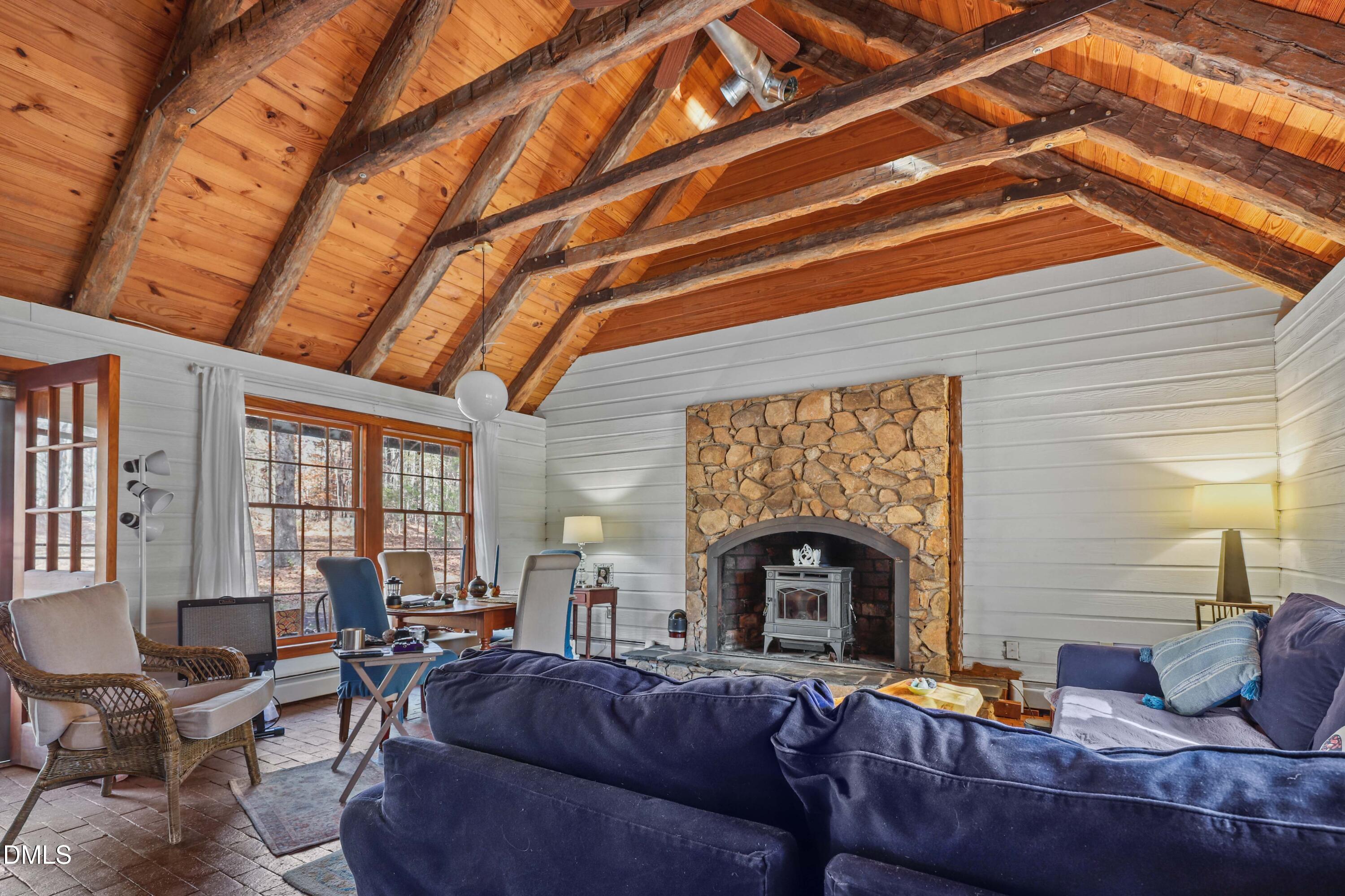 6202 Montgomery Ests Road Hillsborough, NC 27278 - Photo 38 of 91 a living room with furniture and a fireplace