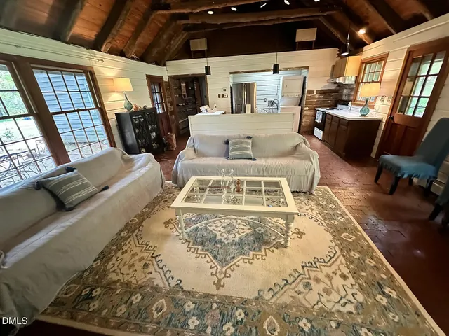 a bathroom with a sink a window and a shower