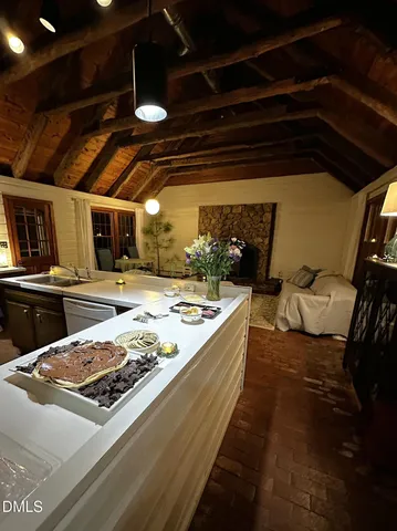 a front view of a house with lots of trees