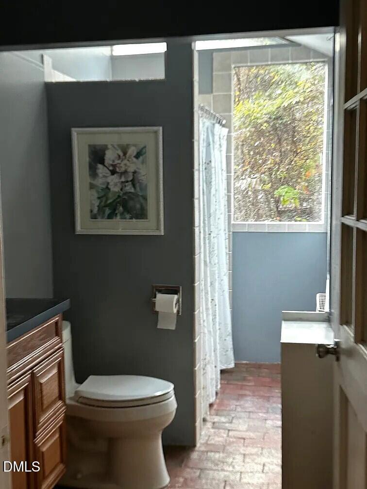 6202 Montgomery Ests Road Hillsborough, NC 27278 - Photo 49 of 91 a white toilet sitting next to a window