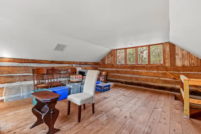 a view of balcony with wooden floor and fence
