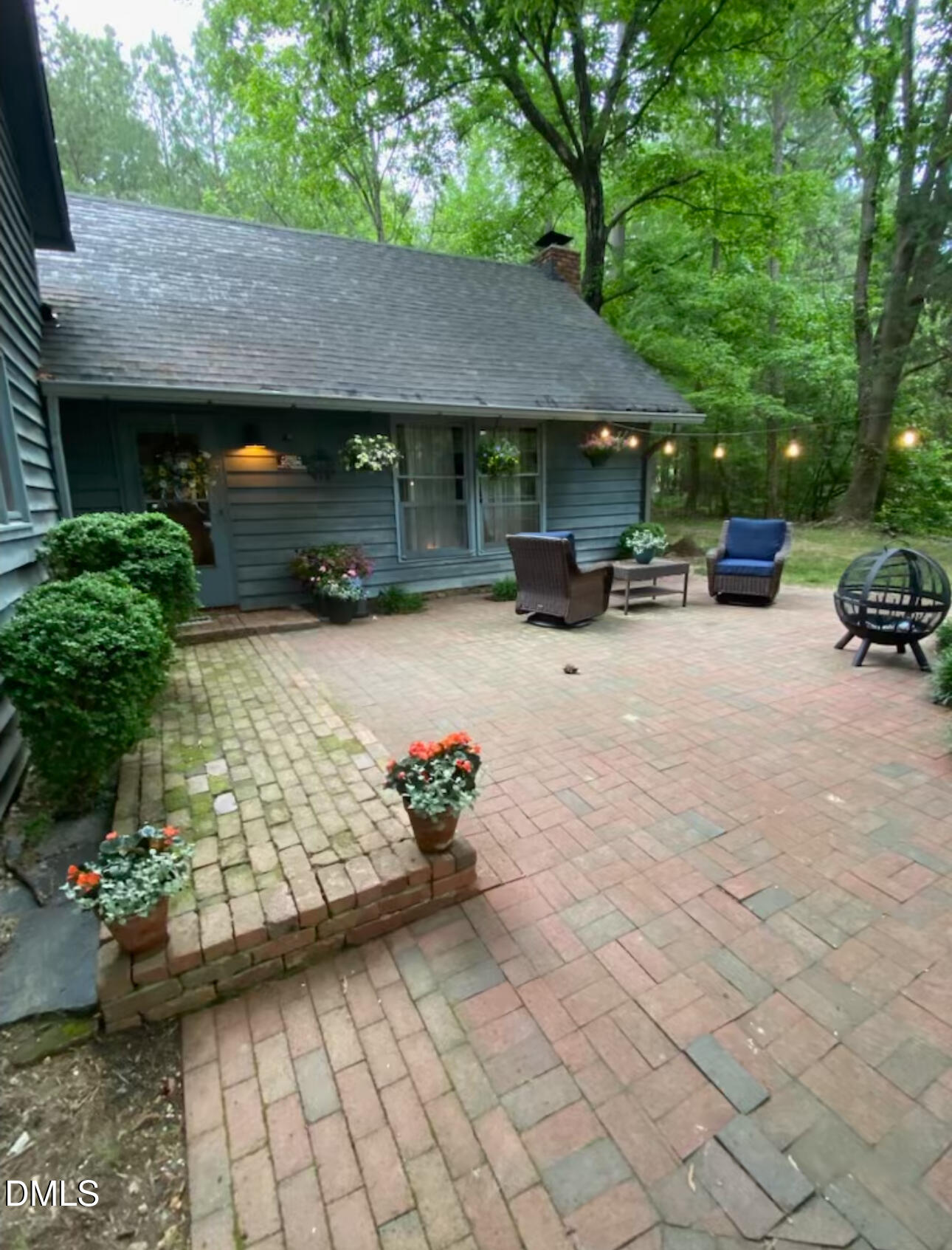 6202 Montgomery Ests Road Hillsborough, NC 27278 - Photo 51 of 91 a view of patio with a table and chairs under an umbrella