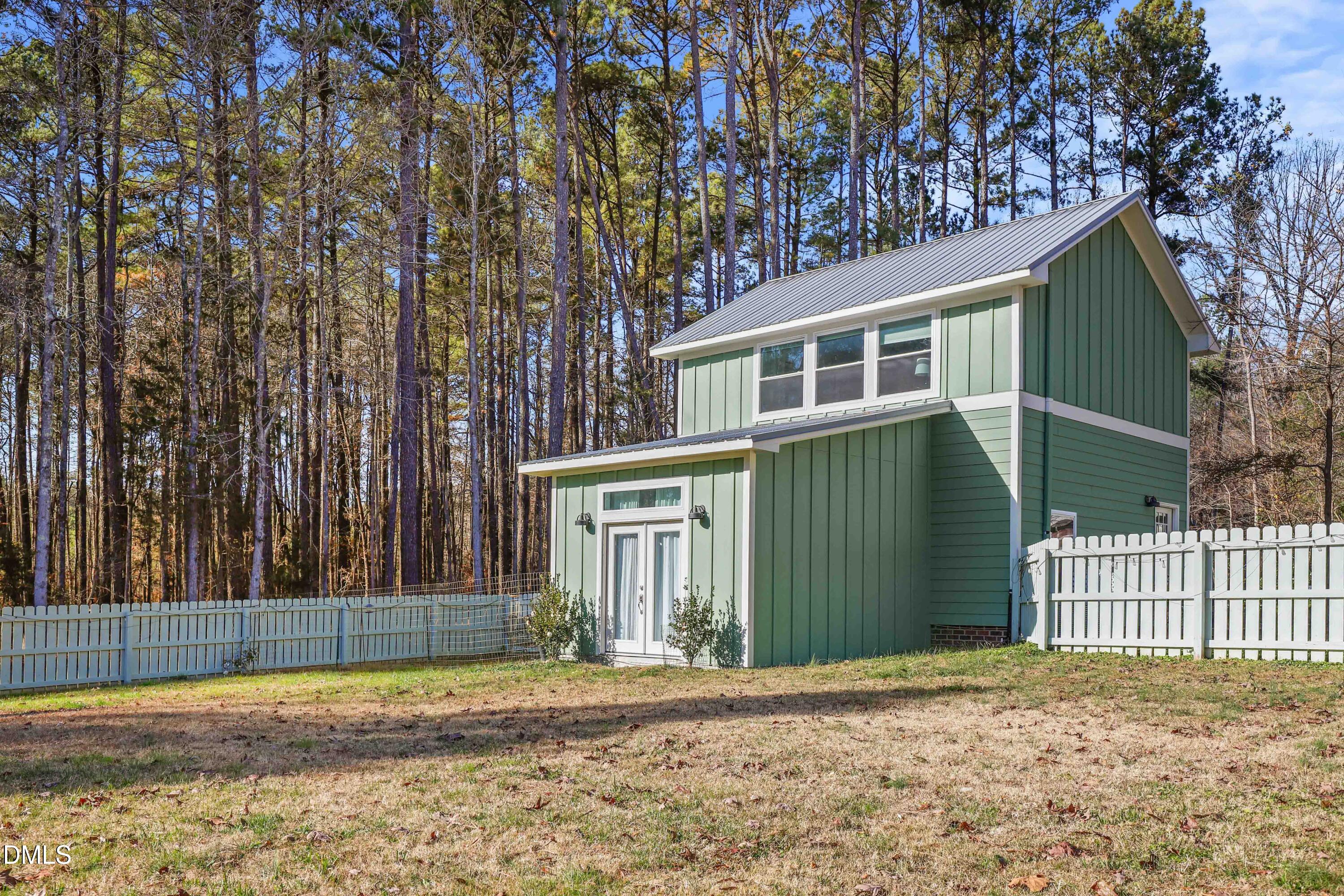 6202 Montgomery Ests Road Hillsborough, NC 27278 - Photo 58 of 91 a front view of a house with a garden