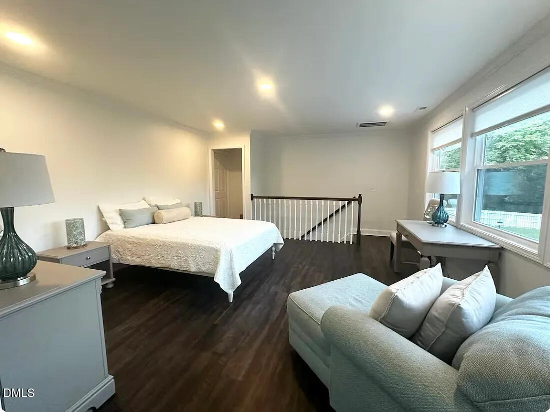 6202 Montgomery Ests Road Hillsborough, NC 27278 - Photo 65 of 91 a bed room with a bed a couch and a window