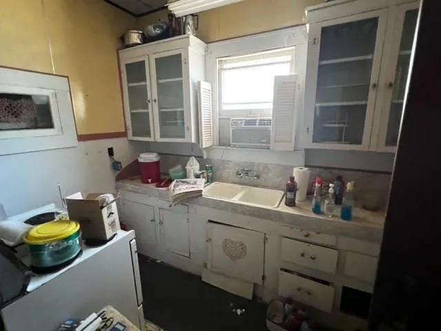 a room with water heater and wooden walls