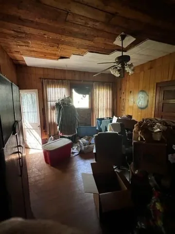 a view of a livingroom with furniture and a flat screen tv