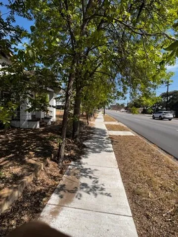 a front view of a house with sitting area