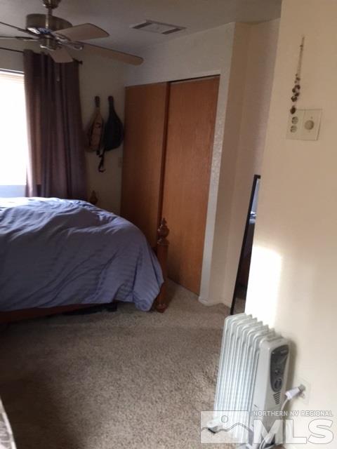 729 Plumas Street Reno, NV 89509 - Photo 11 of 21 a bedroom with a bed and a mirror