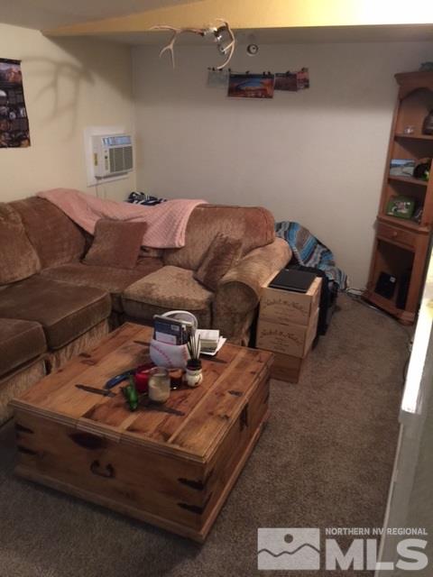729 Plumas Street Reno, NV 89509 - Photo 5 of 21 a bed sitting in a bedroom next to a window