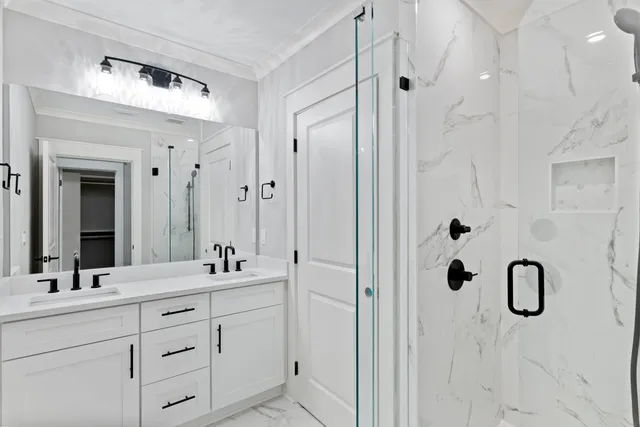 a bathroom with a double vanity sink mirror and double
