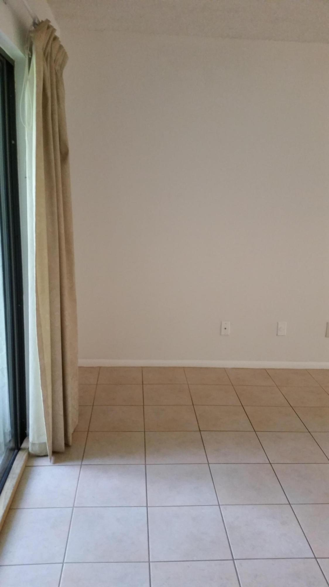 800 Northwest Fork Road, Unit 71 Stuart, FL 34994 - Photo 18 of 23 an empty room with a bench