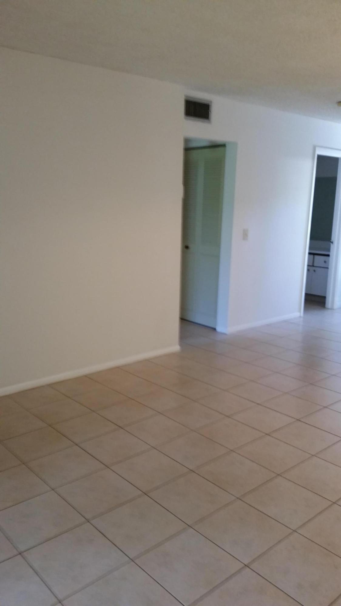 800 Northwest Fork Road, Unit 71 Stuart, FL 34994 - Photo 19 of 23 a view of an empty room and wooden floor