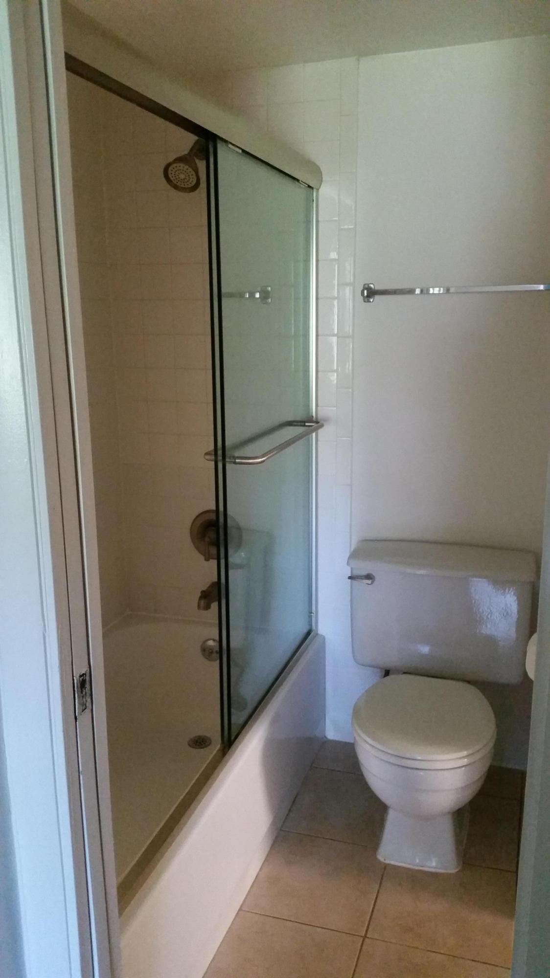800 Northwest Fork Road, Unit 71 Stuart, FL 34994 - Photo 4 of 23 a bathroom with a toilet and a shower