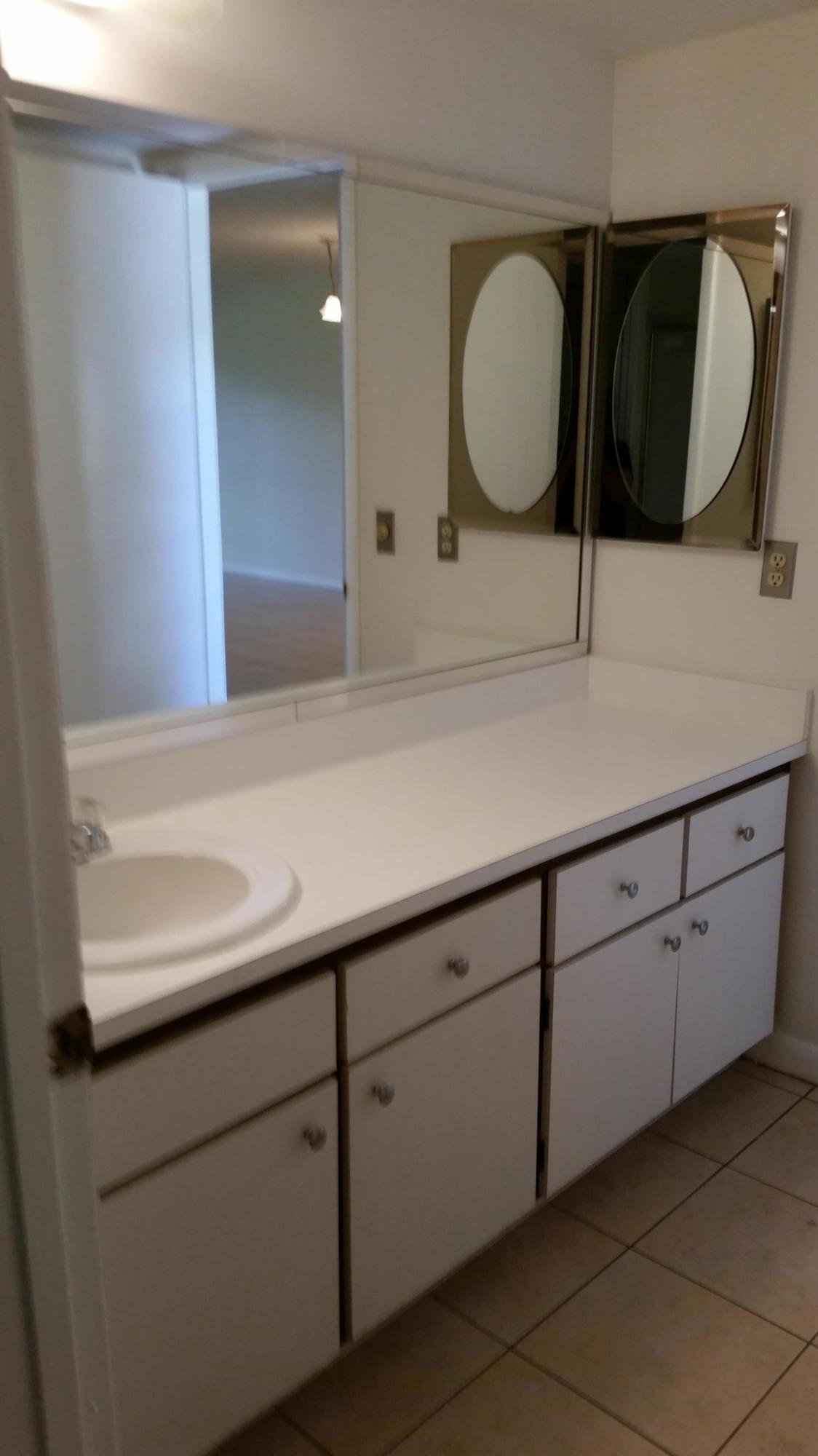 800 Northwest Fork Road, Unit 71 Stuart, FL 34994 - Photo 5 of 23 a bathroom with a sink and a mirror