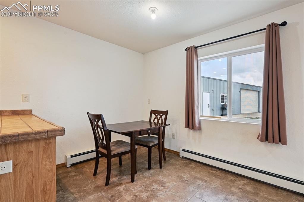 1220 Choate Lane Yoder, CO 80864 - Photo 12 of 47 a dining room with furniture and window
