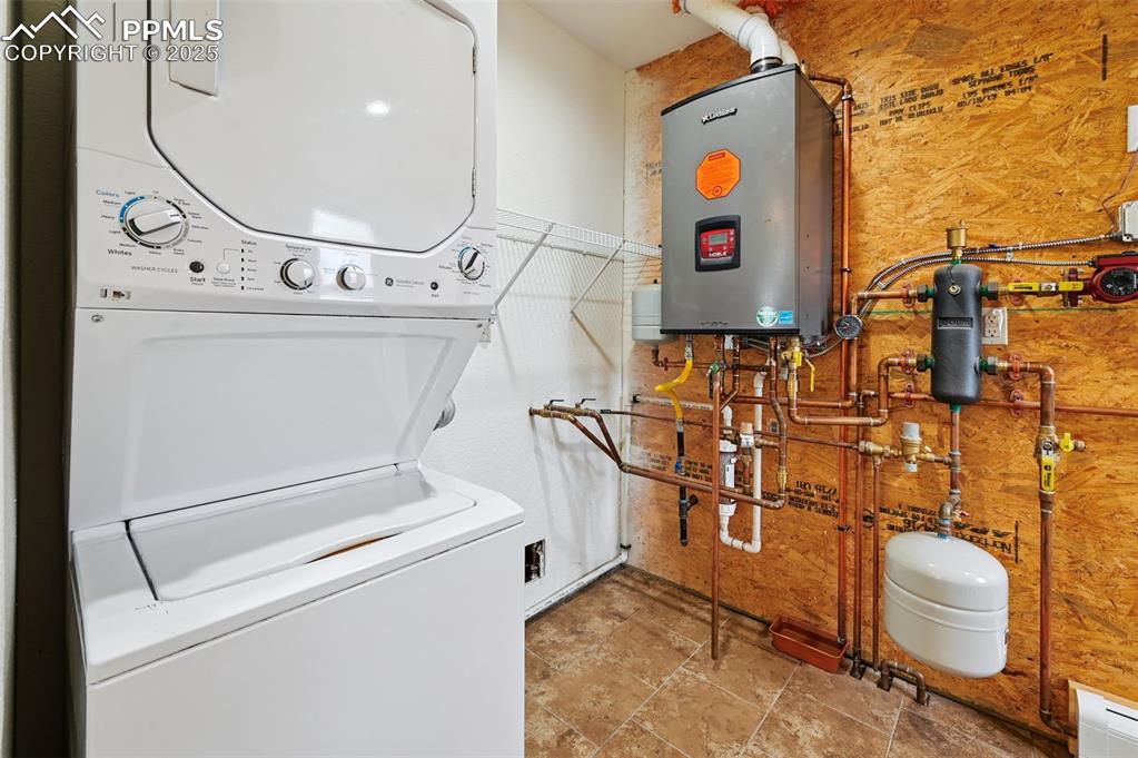 1220 Choate Lane Yoder, CO 80864 - Photo 16 of 47 a utility room with dryer and washer