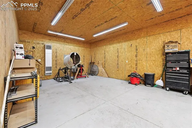 a view of an empty room with a staircase