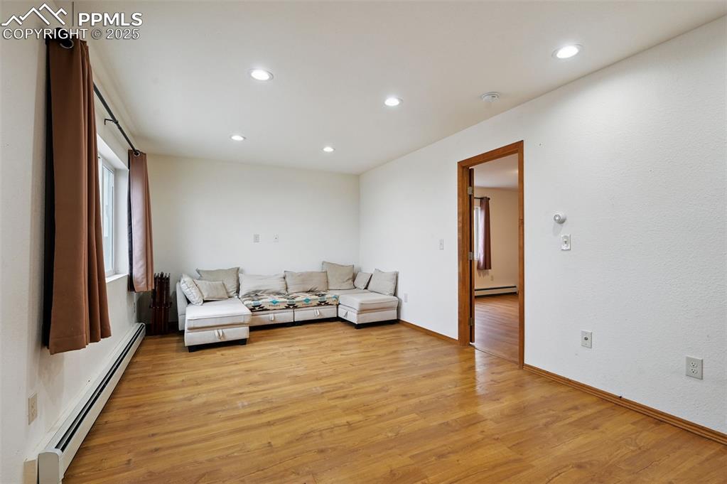 1220 Choate Lane Yoder, CO 80864 - Photo 9 of 47 a living room with furniture and large window