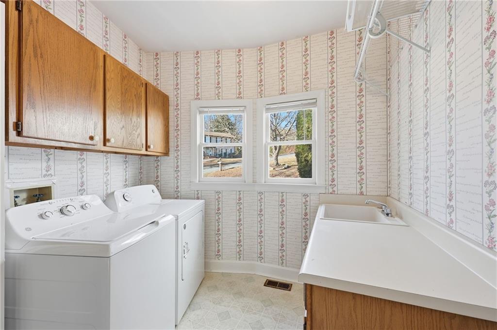 2453 Basin Court Gainesville, GA 30506 - Photo 16 of 47 a utility room with dryer and washer