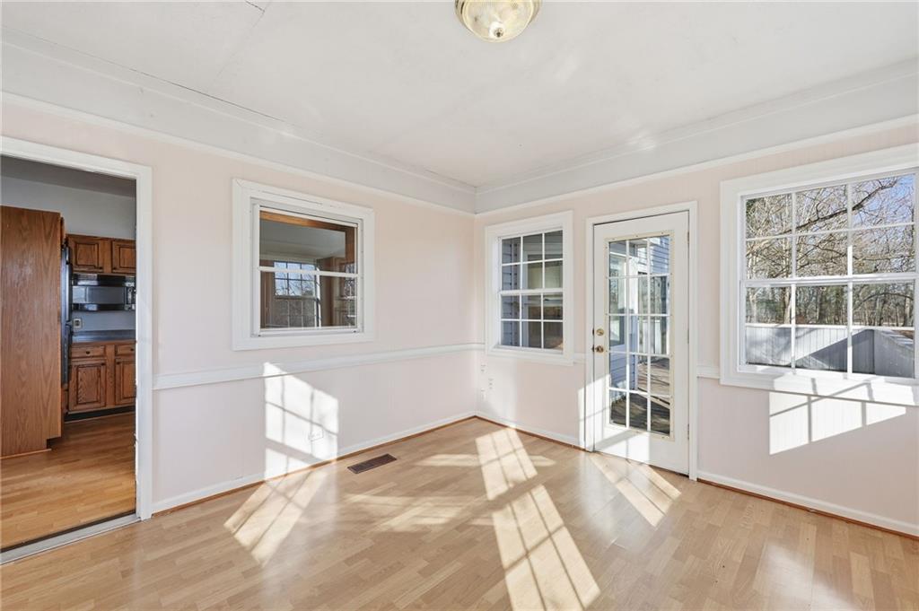 2453 Basin Court Gainesville, GA 30506 - Photo 18 of 47 a view of a livingroom with wooden floor and a bedroom
