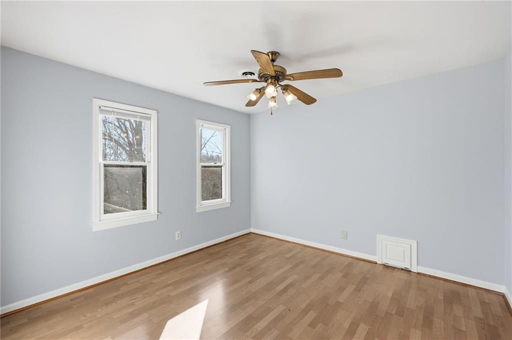 2453 Basin Court Gainesville, GA 30506 - Photo 33 of 47 an empty room with a window and a fan