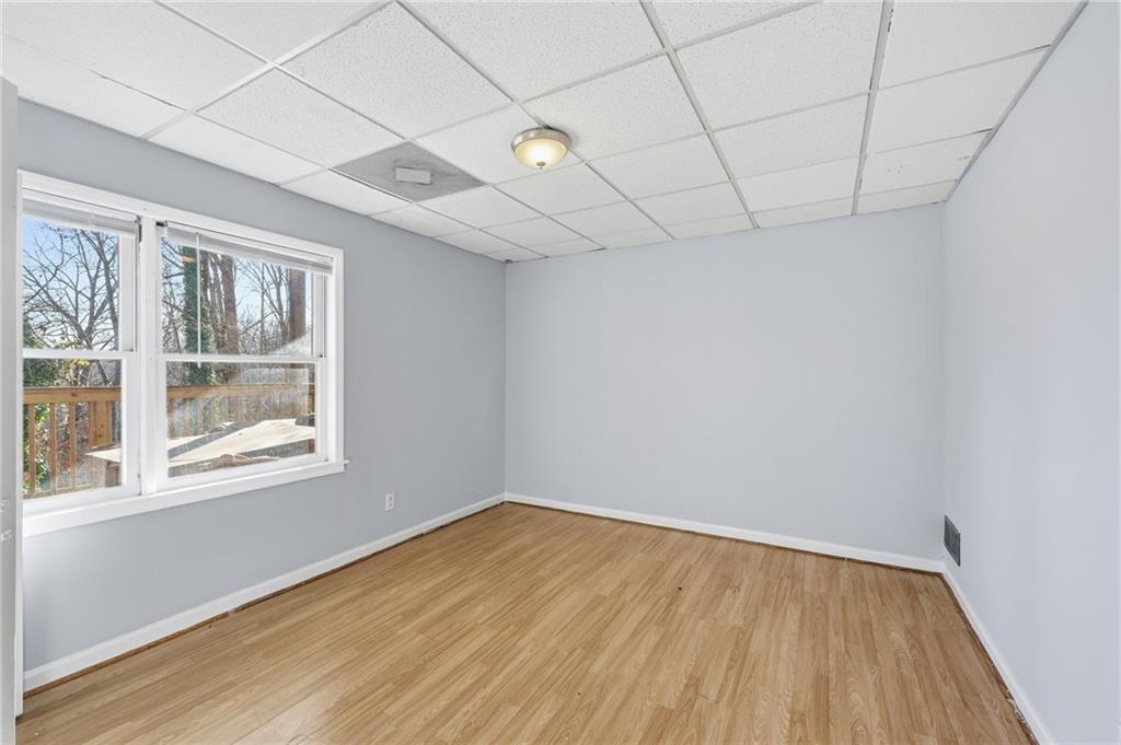 2453 Basin Court Gainesville, GA 30506 - Photo 39 of 47 a view of empty room with wooden floor and fan