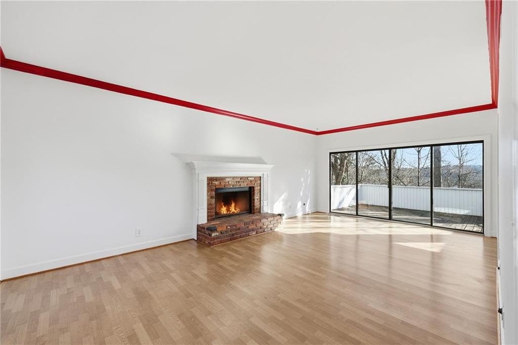 2453 Basin Court Gainesville, GA 30506 - Photo 8 of 47 a view of an empty room with wooden floor and a window