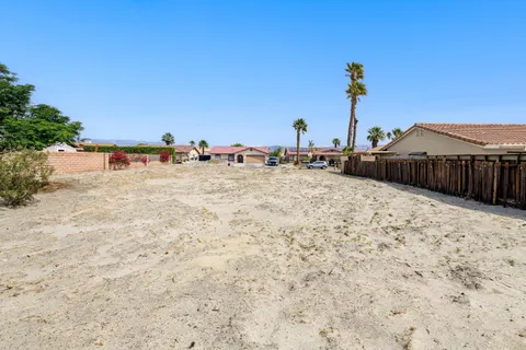a view of a lake with a building in the background