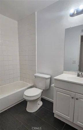a bathroom with a sink a toilet and a bathtub
