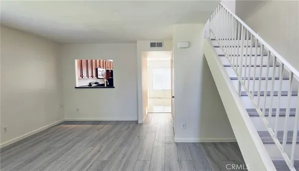 a view of entryway with wooden floor