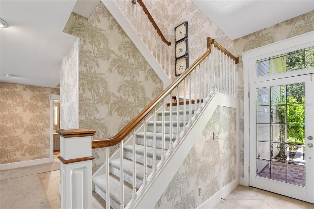 17810 Crawley Road Odessa, FL 33556 - Photo 33 of 76 a view of entryway with wooden floor and stairs
