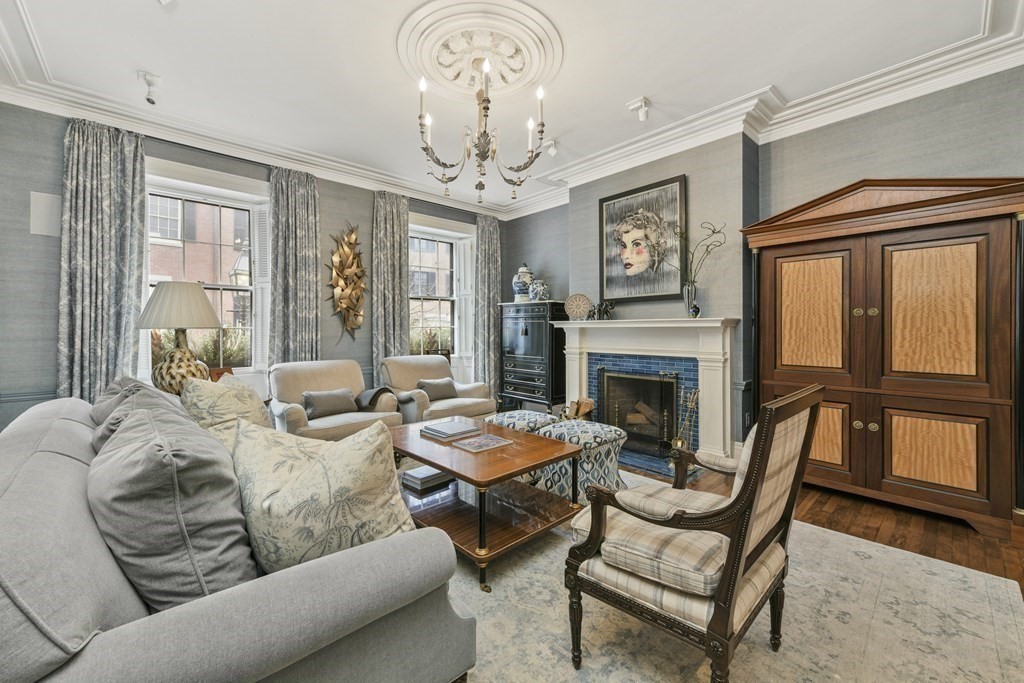 59 Chestnut Street Boston, MA 02108 - Photo 2 of 33 a living room with furniture a chandelier and a fireplace