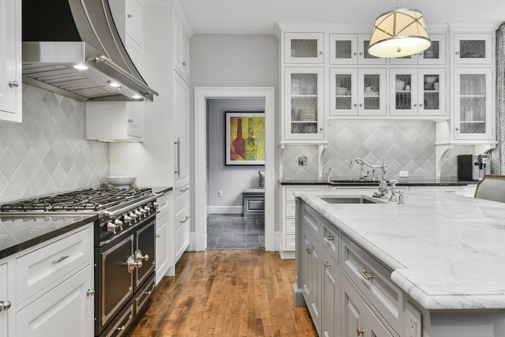 59 Chestnut Street Boston, MA 02108 - Photo 8 of 33 a kitchen with a stove a sink and a refrigerator
