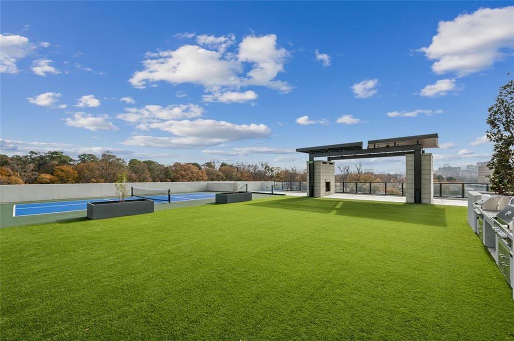 2425 Peachtree Street Northeast, Unit 1106 Atlanta, GA 30305 - Photo 25 of 43 a view of a big room with pool table and a fire pit