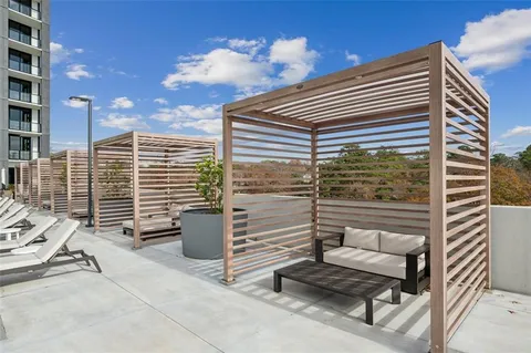 a view of pool with outdoor seating and yard