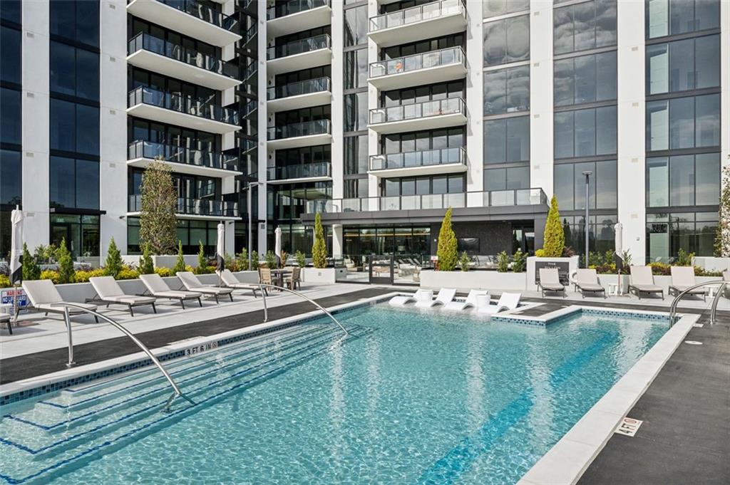 2425 Peachtree Street Northeast, Unit 1106 Atlanta, GA 30305 - Photo 33 of 43 a view of pool with outdoor seating and yard