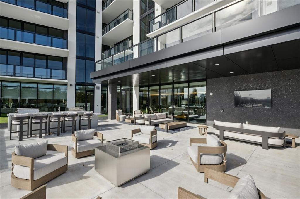 2425 Peachtree Street Northeast, Unit 1106 Atlanta, GA 30305 - Photo 35 of 43 a building outdoor space with patio furniture and potted plants