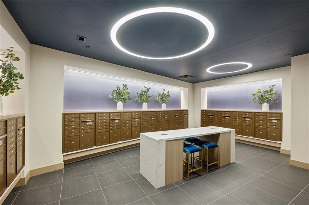 2425 Peachtree Street Northeast, Unit 1106 Atlanta, GA 30305 - Photo 38 of 43 a kitchen with a sink and chandelier