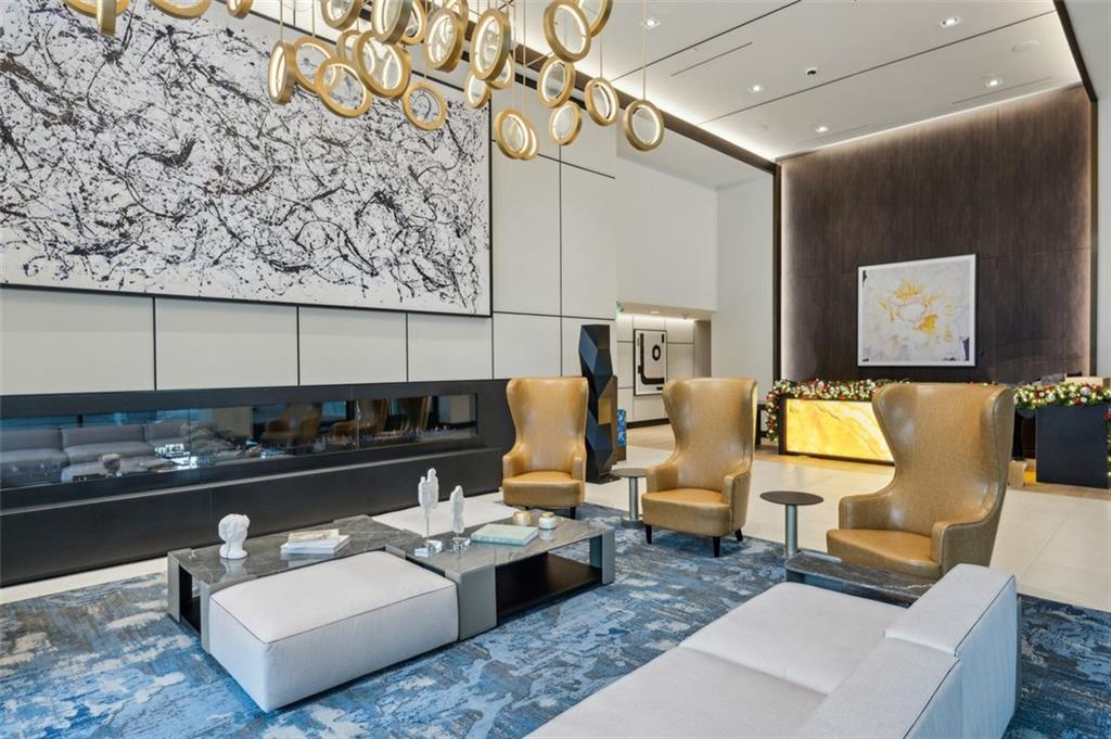 2425 Peachtree Street Northeast, Unit 1106 Atlanta, GA 30305 - Photo 39 of 43 a living room with furniture and rug