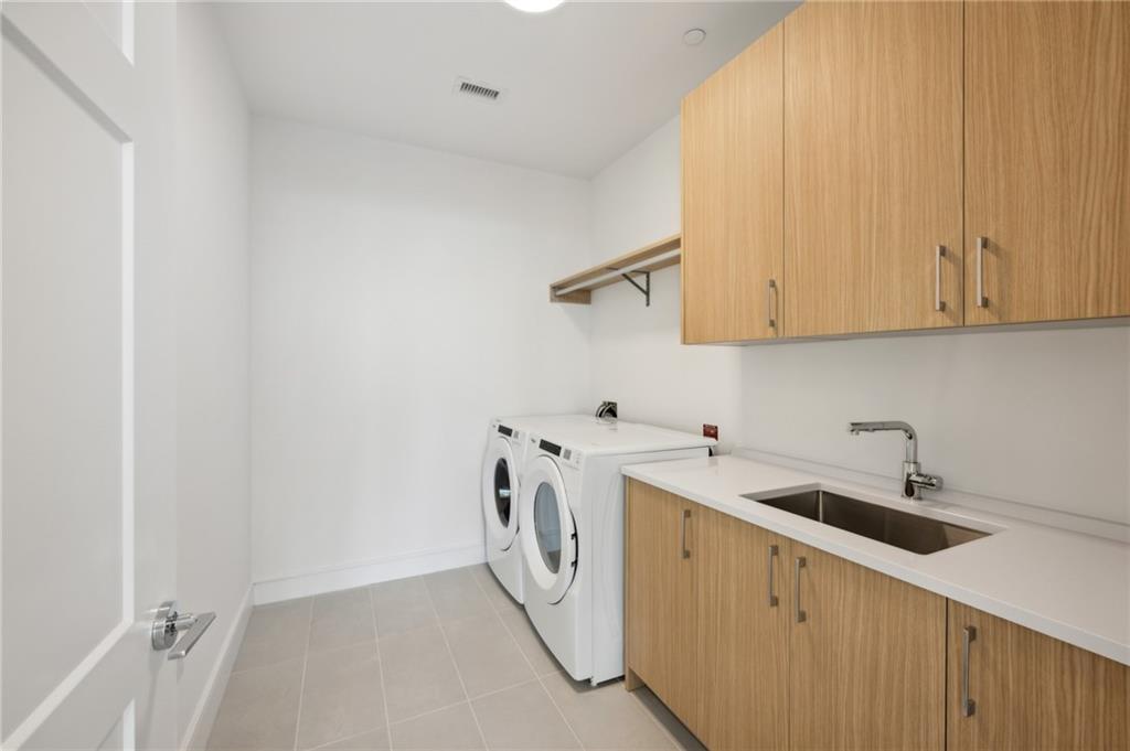 2425 Peachtree Street Northeast, Unit 1106 Atlanta, GA 30305 - Photo 10 of 43 a utility room with dryer and washer
