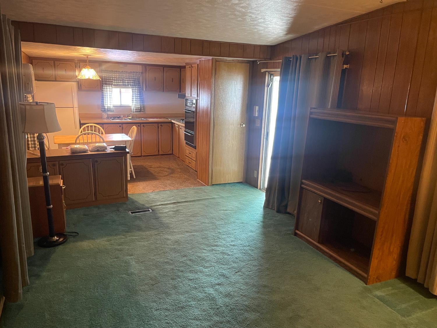 5835 Cherokee Road, Unit 52 Stockton, CA 95215 - Photo 11 of 19 a room with a refrigerator and a sink