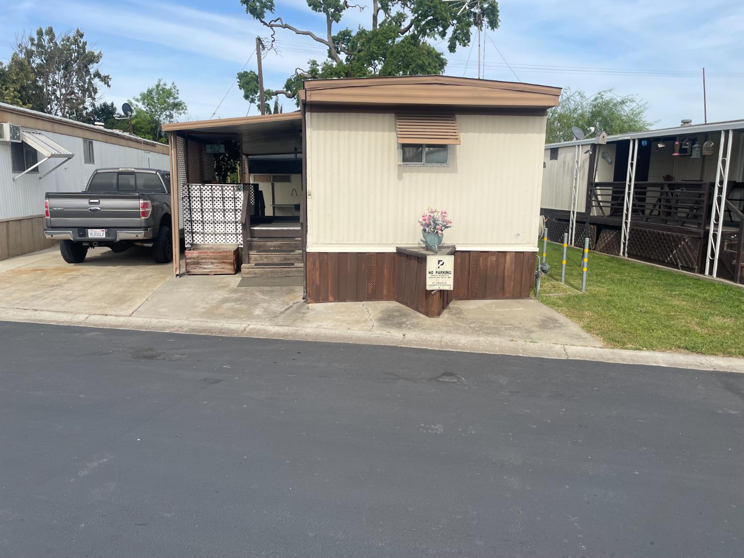 5835 Cherokee Road, Unit 52 Stockton, CA 95215 - Photo 2 of 19 a front view of a house with a garage