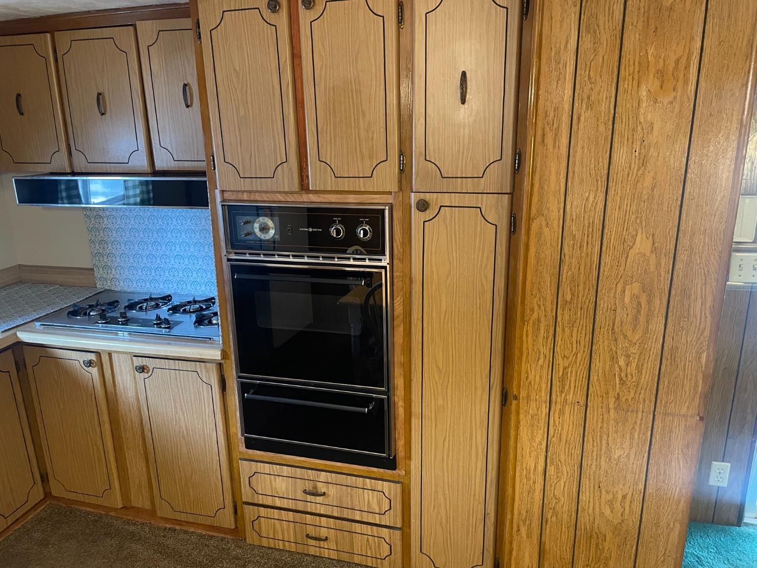 5835 Cherokee Road, Unit 52 Stockton, CA 95215 - Photo 7 of 19 a kitchen with granite countertop white cabinets and stainless steel appliances