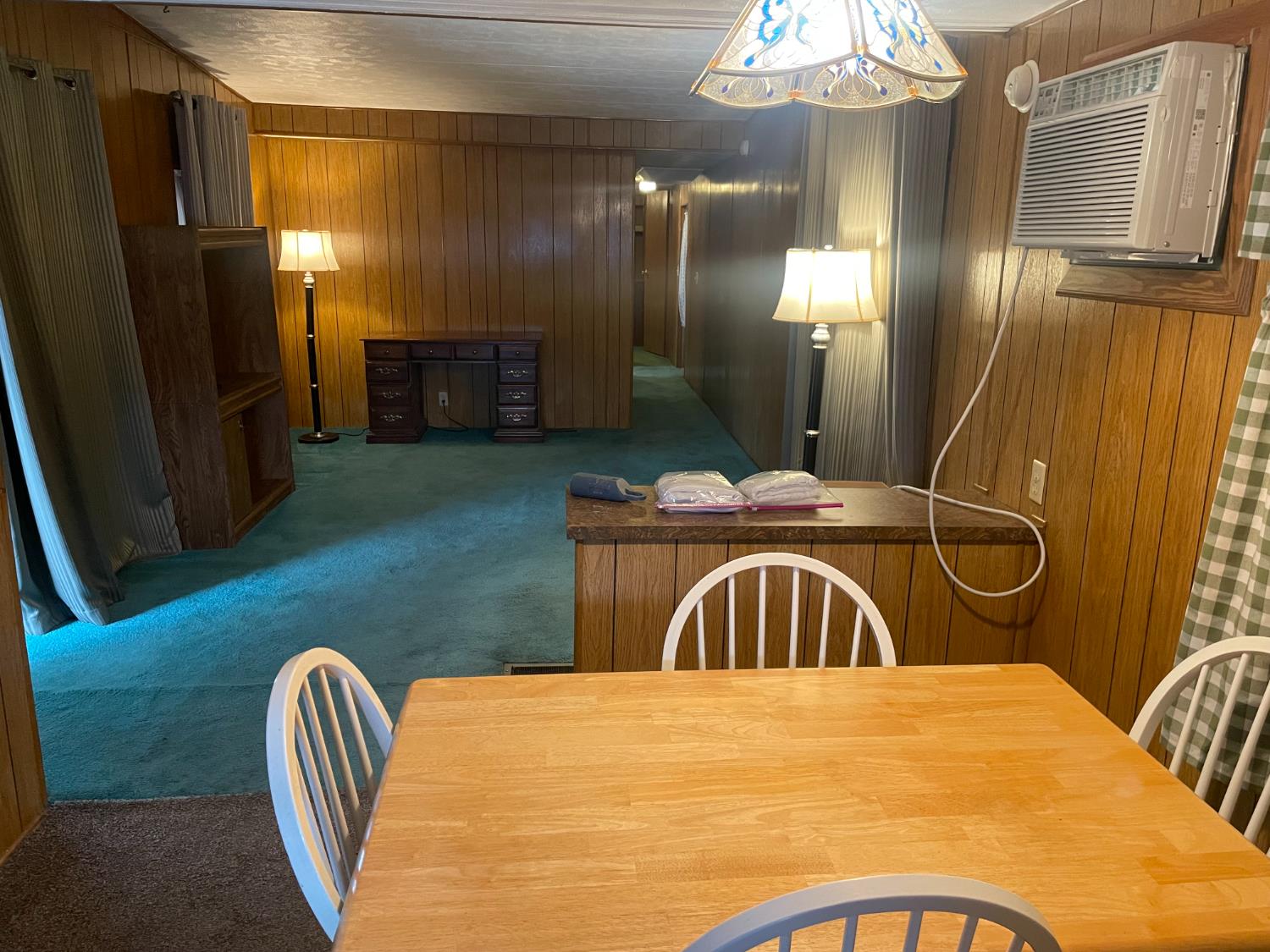 5835 Cherokee Road, Unit 52 Stockton, CA 95215 - Photo 9 of 19 a bedroom with a bed and a chandelier