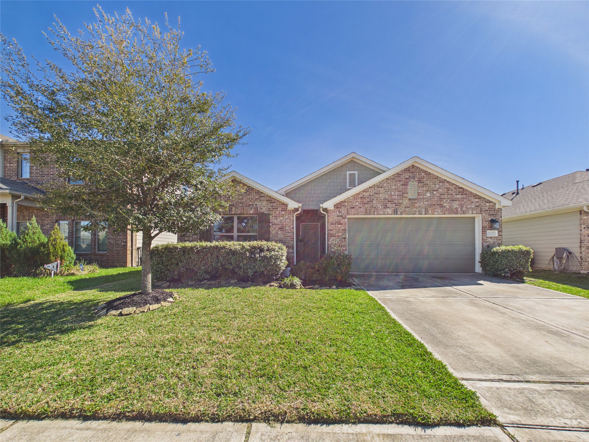 1237 Steed Bluff Drive Alvin, TX 77511 - Photo 49 of 50 a view of a front of a house with a yard